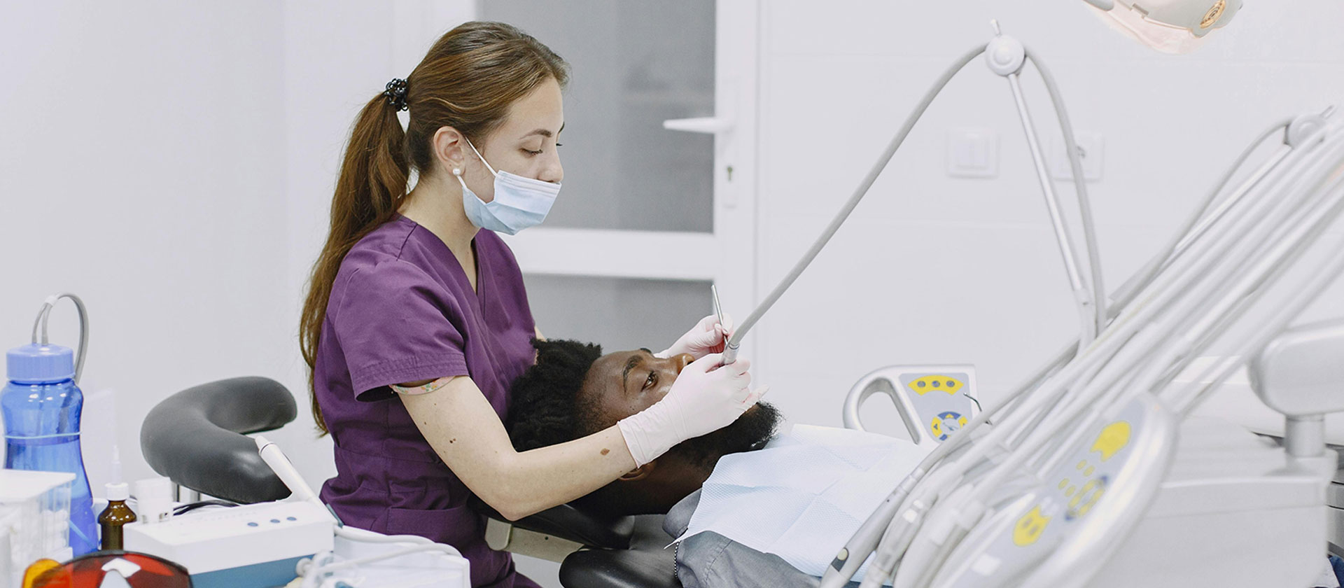 Dentist treating a patient at Northdene Dental Clinic in Guildford