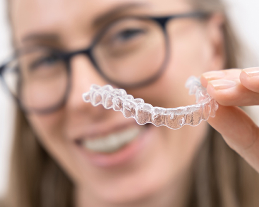 Patient using Invisalign aligners